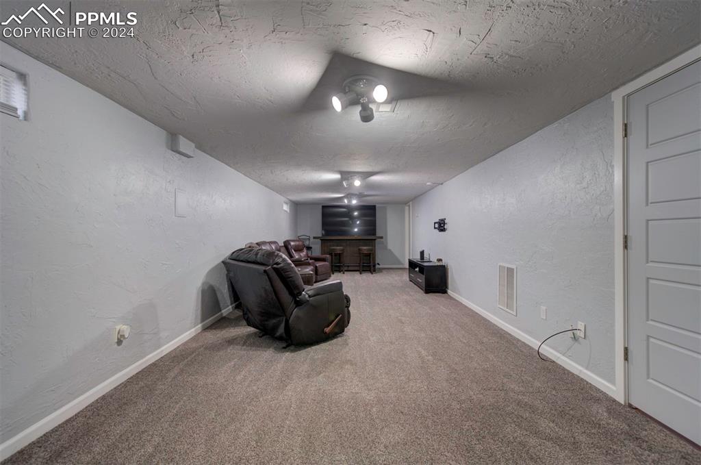 50 Duke Street Pueblo, CO 81005 - Photo 39 of 45 a living room with furniture and a chandelier