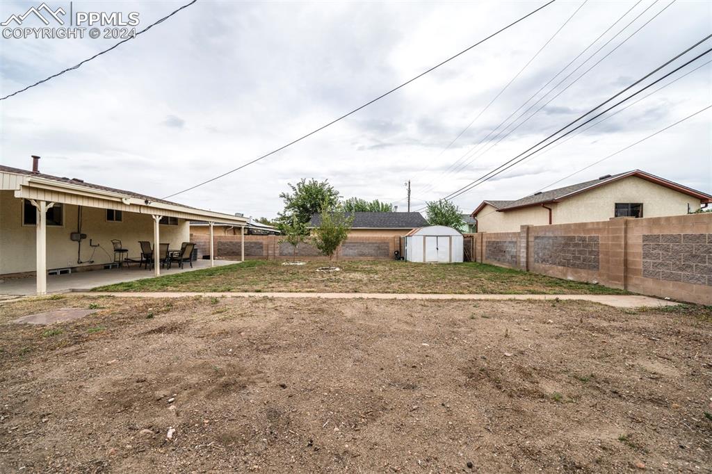 50 Duke Street Pueblo, CO 81005 - Photo 4 of 45 a front view of a house with a yard