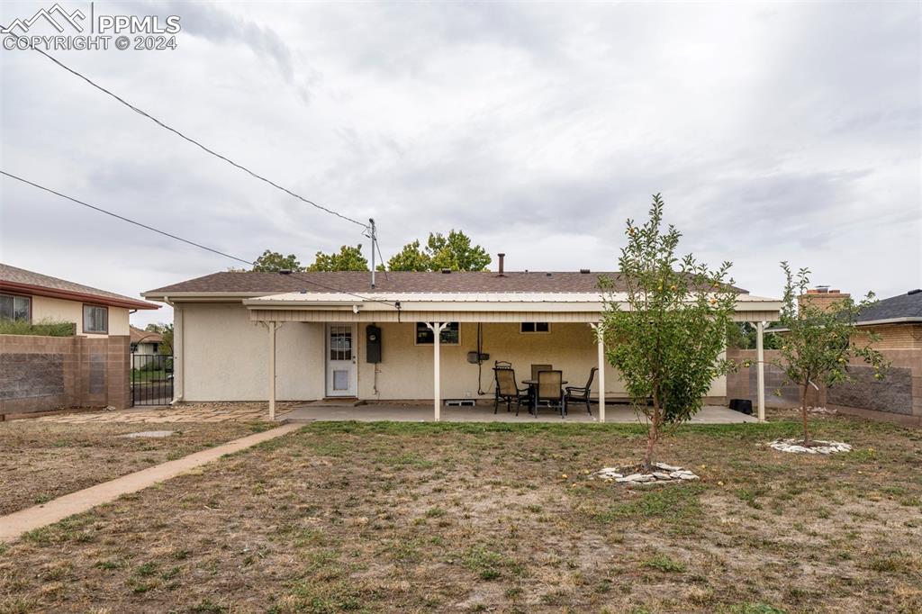 50 Duke Street Pueblo, CO 81005 - Photo 6 of 45 a backyard of a house with lots of green space