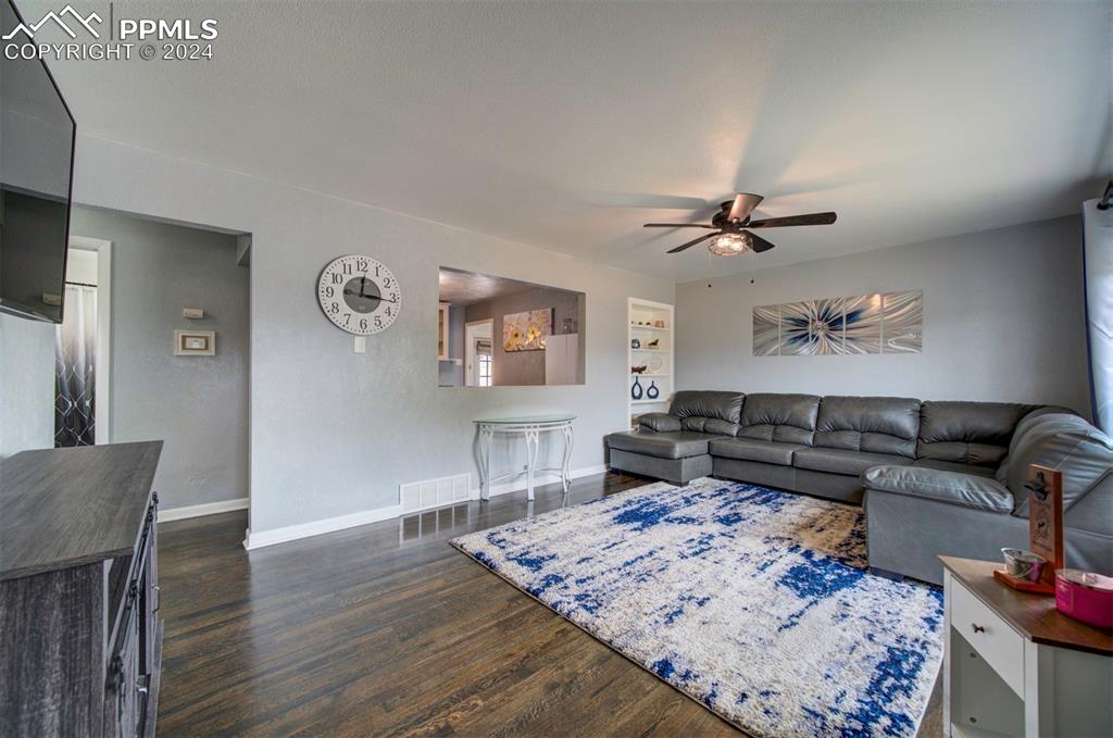 50 Duke Street Pueblo, CO 81005 - Photo 8 of 45 a living room with furniture and a wooden floor