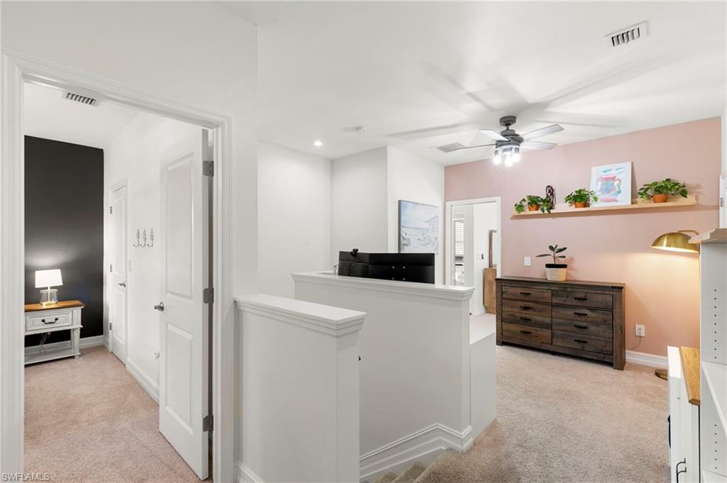 7421 Rockefeller Drive Naples, FL 34119 - Photo 11 of 37 a view of a hallway view with staircase