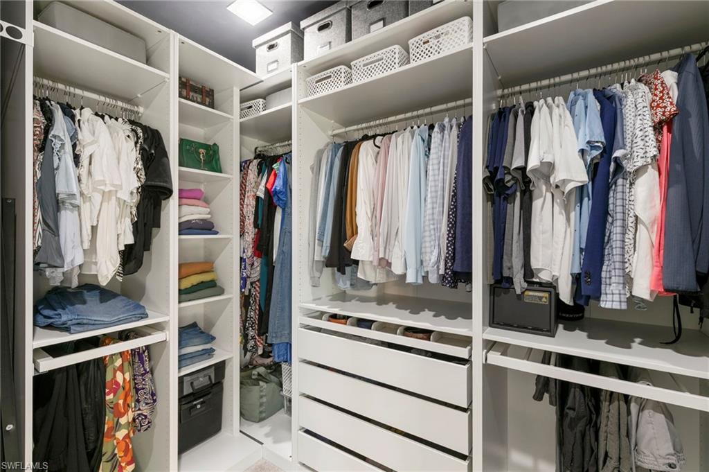 7421 Rockefeller Drive Naples, FL 34119 - Photo 19 of 37 a view of walk in closet with clothes and shoes