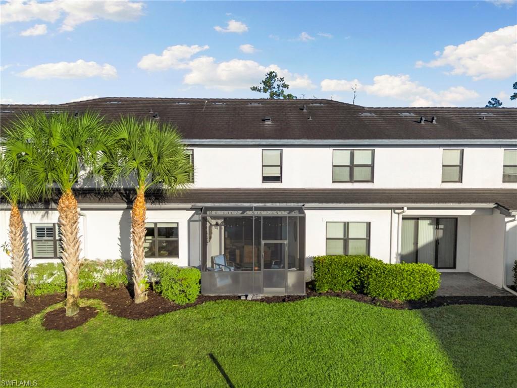 7421 Rockefeller Drive Naples, FL 34119 - Photo 29 of 37 front view of a house with a yard