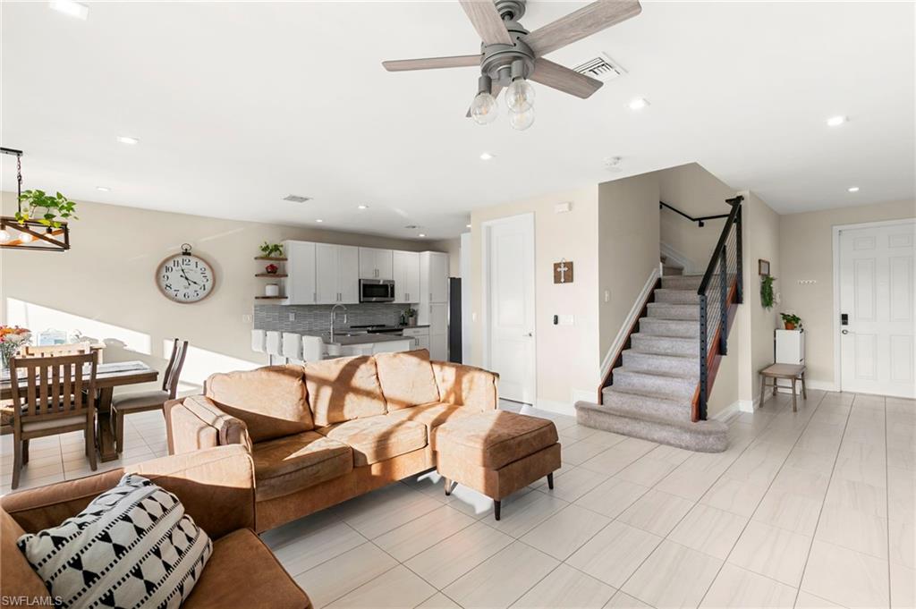 7421 Rockefeller Drive Naples, FL 34119 - Photo 4 of 37 a living room with furniture and wooden floor