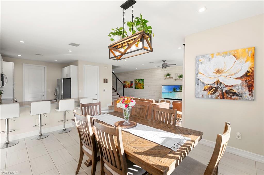 7421 Rockefeller Drive Naples, FL 34119 - Photo 7 of 37 a view of a dining room with furniture