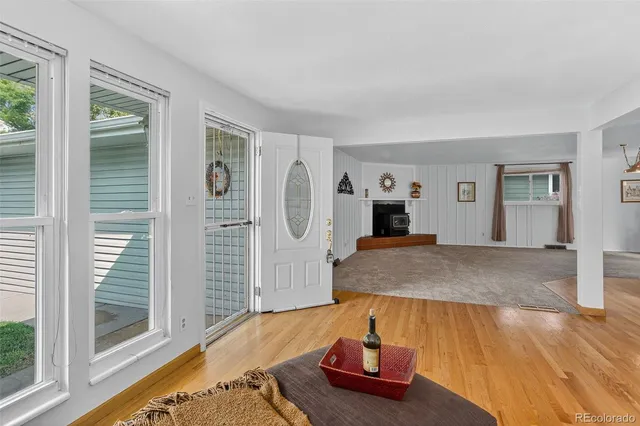 a room with wooden floor and furniture