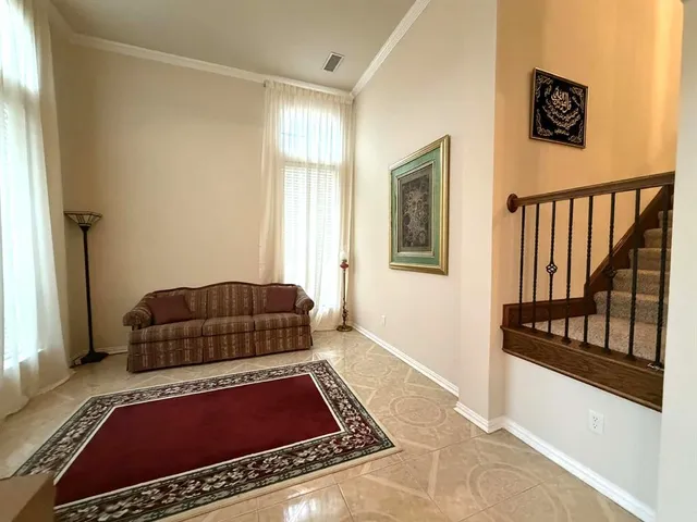 a living room with a couch and a window