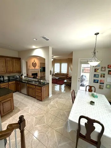 a bathroom with a sink mirror and toilet