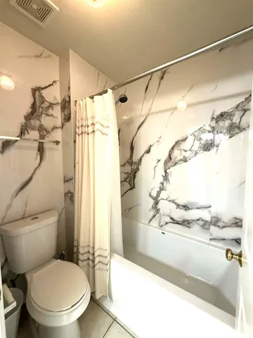 a bathroom with a sink double vanity and a mirror