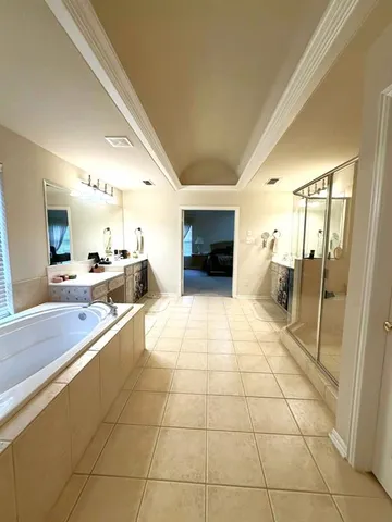 a large white kitchen with a stove a sink dishwasher and a refrigerator