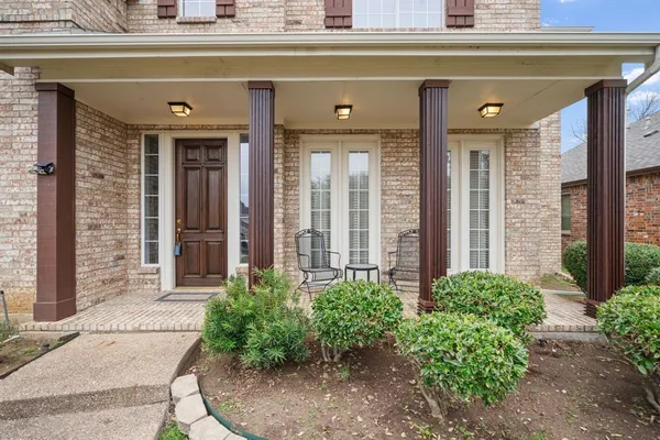 a view of entryway bedroom and hall with wooden floor