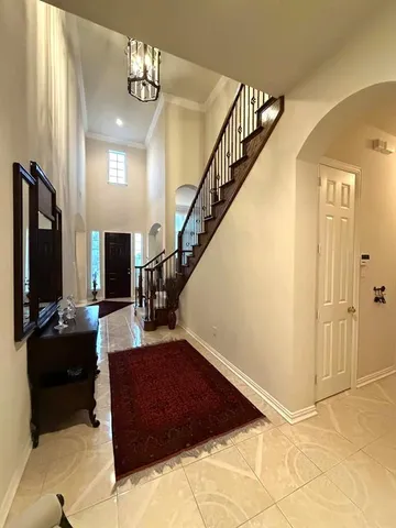 a view of a livingroom with furniture staircase and a livingroom