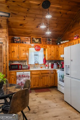 a dining room filled with furniture and a clock