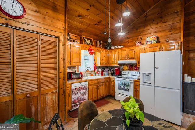 a dining room with furniture window and outside view