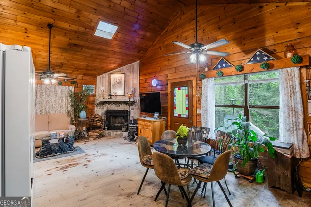 a view of livingroom with furniture and a fireplace