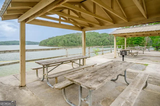 a front view of a house with a yard and fountain