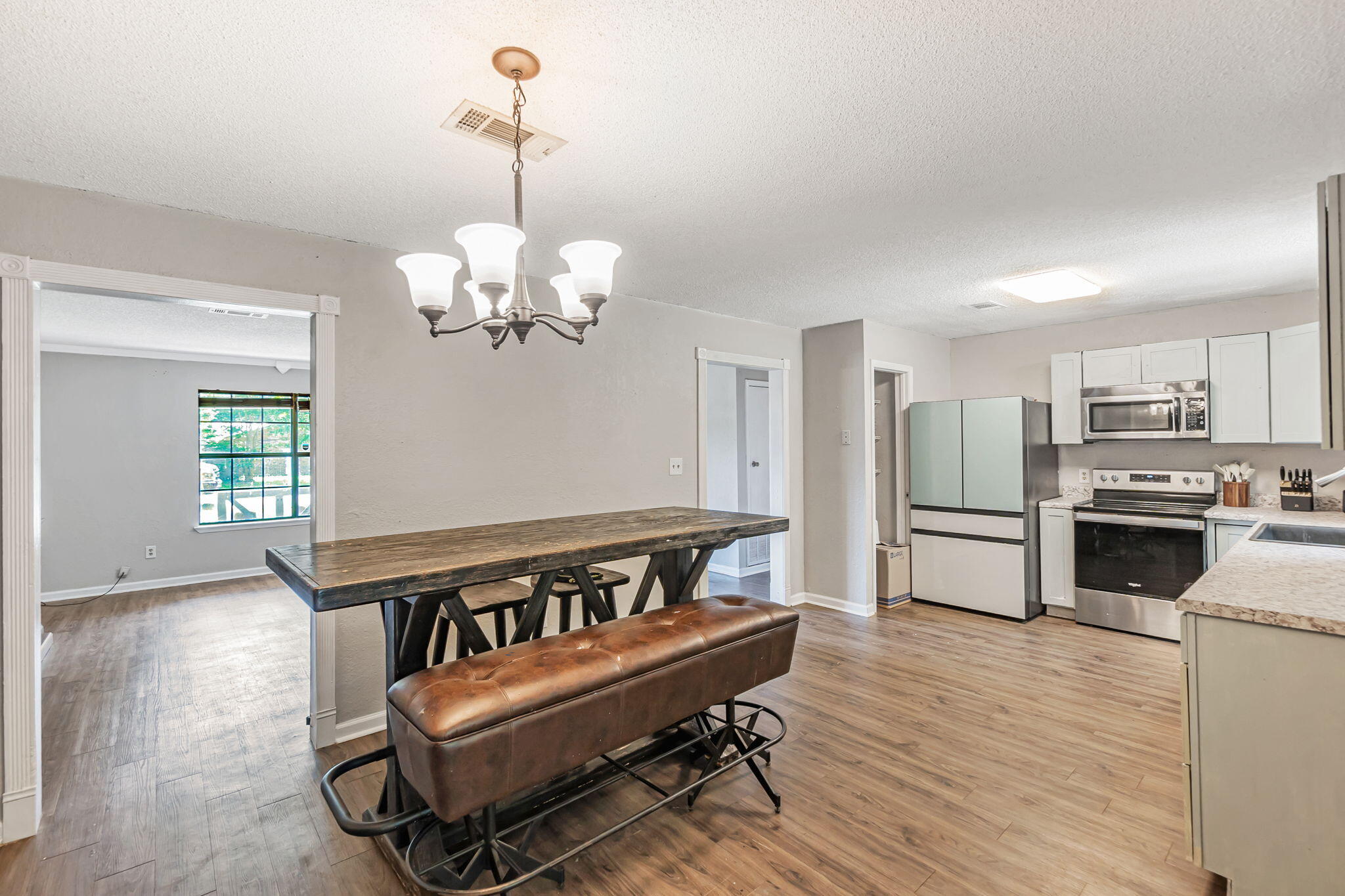 6517 Kennington Circle Milton, FL 32570 - Photo 15 of 37 a view of kitchen with furniture and wooden floor