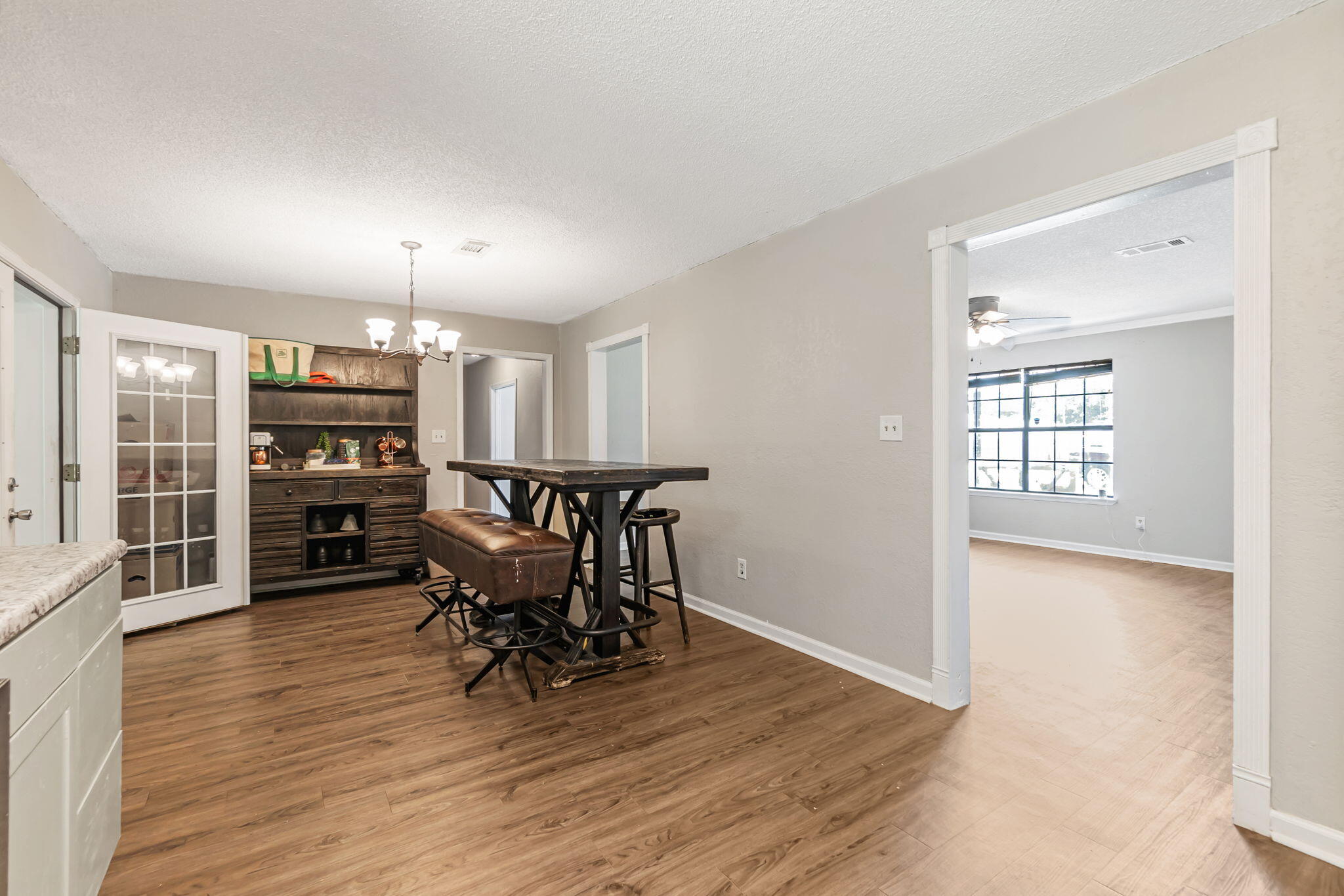 6517 Kennington Circle Milton, FL 32570 - Photo 17 of 37 a view of a dining room with furniture and wooden floor