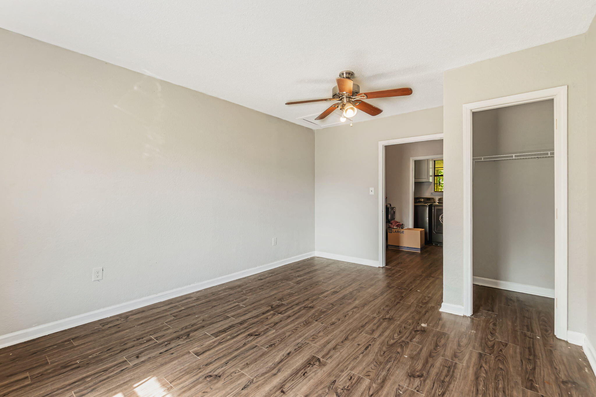 6517 Kennington Circle Milton, FL 32570 - Photo 19 of 37 a view of a room with wooden floor and ceiling fan