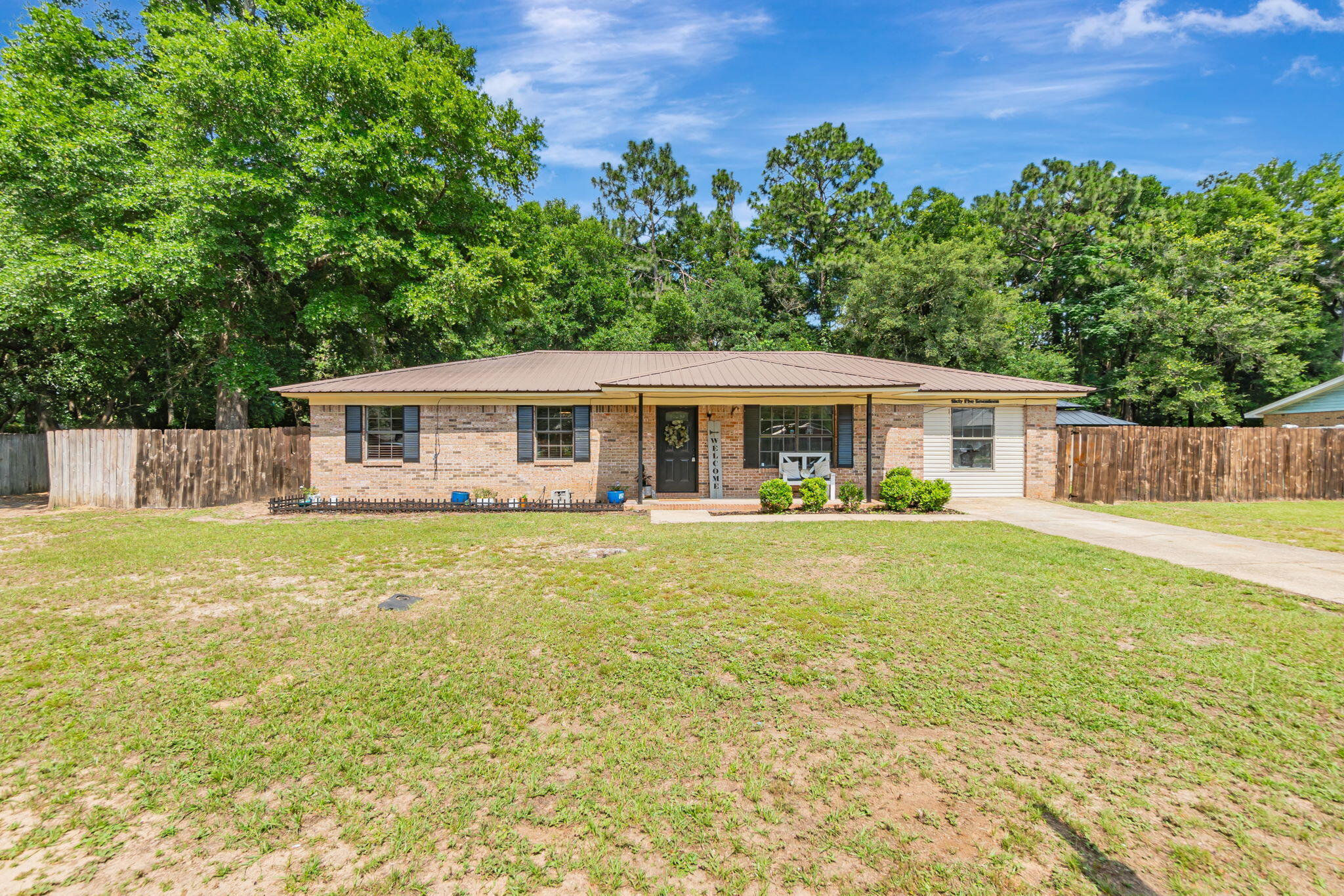 6517 Kennington Circle Milton, FL 32570 - Photo 2 of 37 a view of a house with a backyard