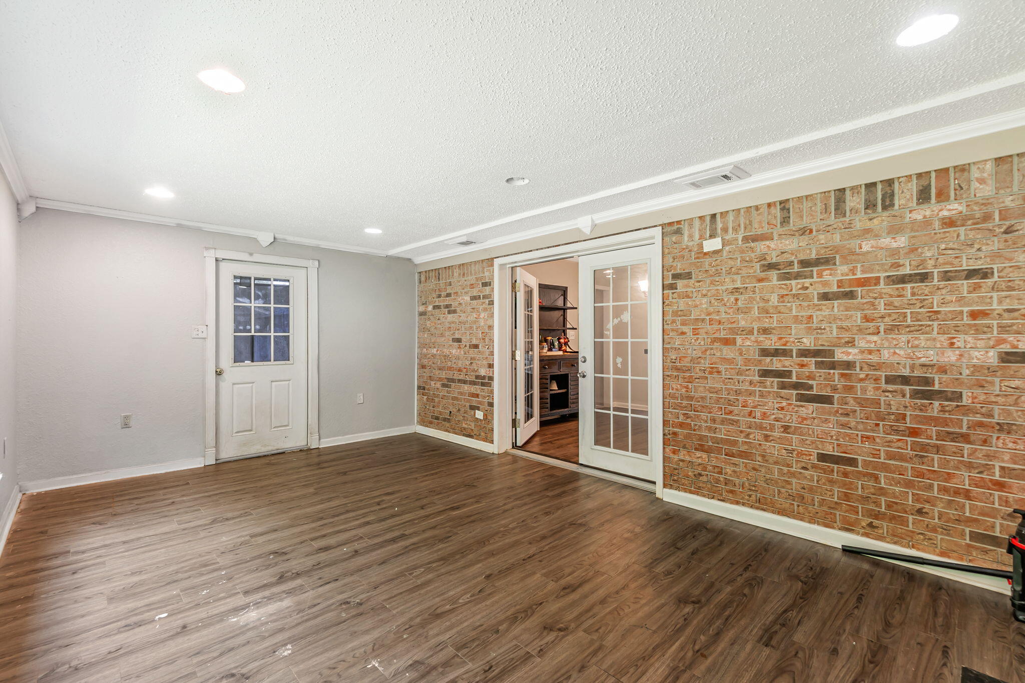6517 Kennington Circle Milton, FL 32570 - Photo 21 of 37 wooden floor in an empty room with a window