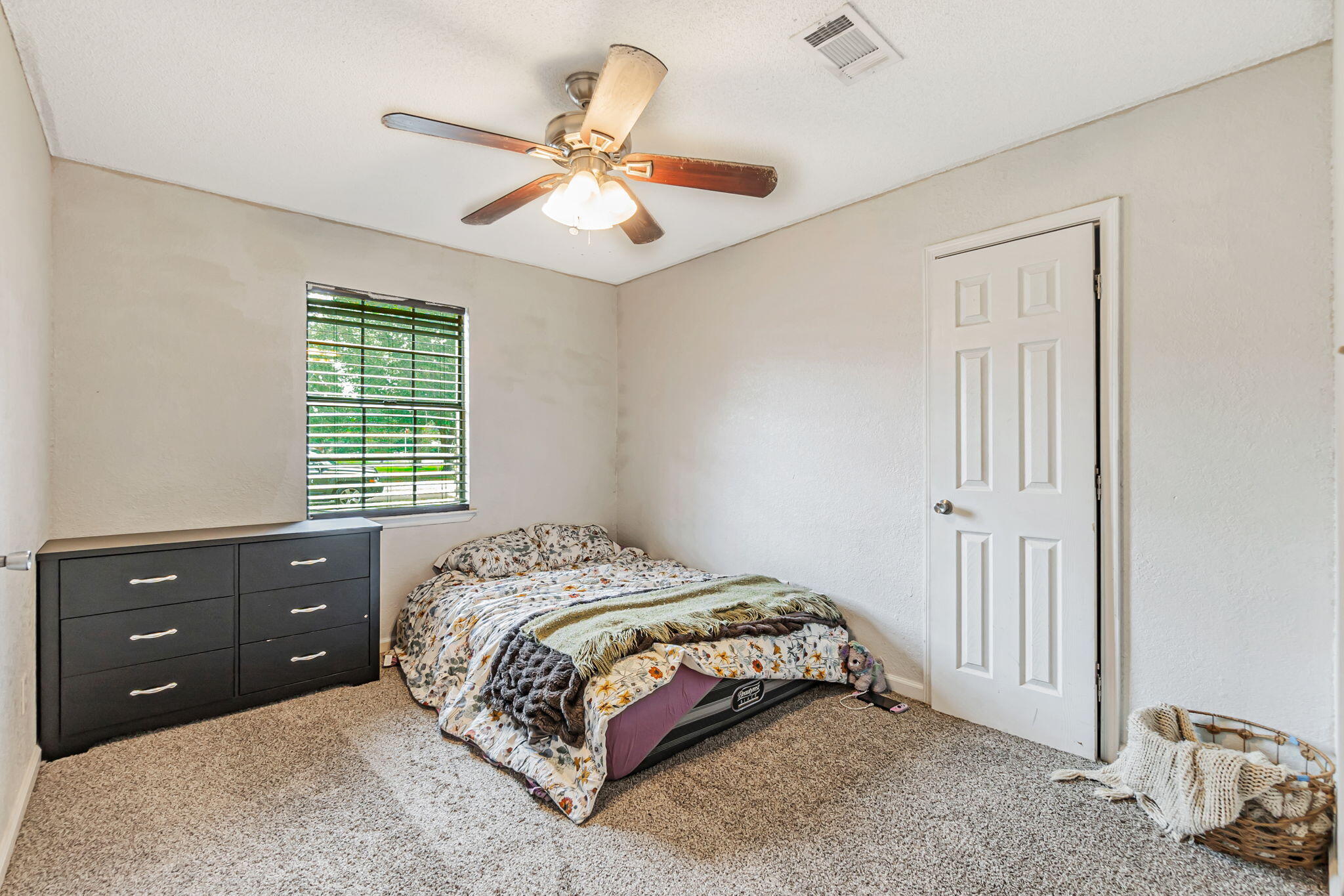 6517 Kennington Circle Milton, FL 32570 - Photo 22 of 37 a bedroom with a bed and a dresser