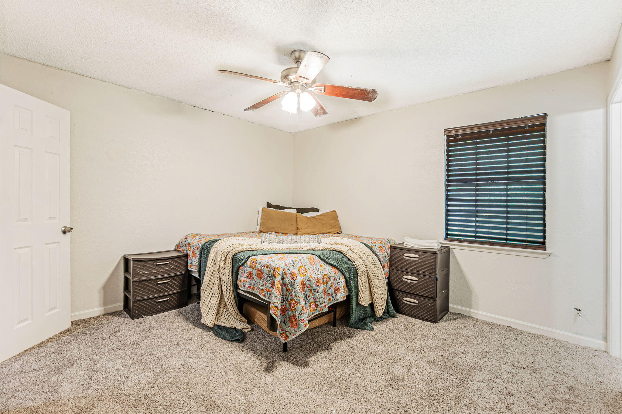 6517 Kennington Circle Milton, FL 32570 - Photo 27 of 37 a bedroom with a bed and a chandelier
