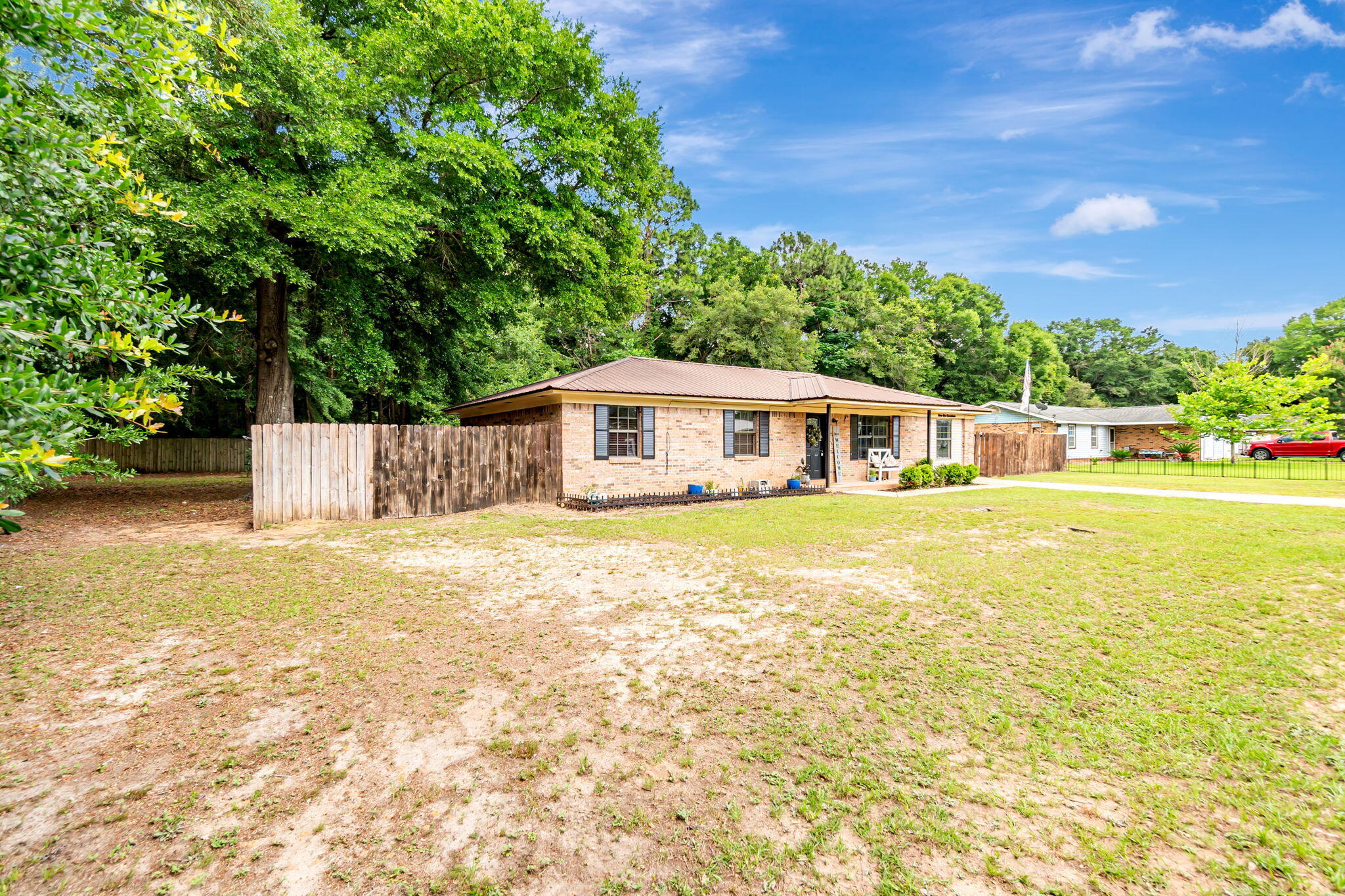 6517 Kennington Circle Milton, FL 32570 - Photo 3 of 37 a house with swimming pool in front of it
