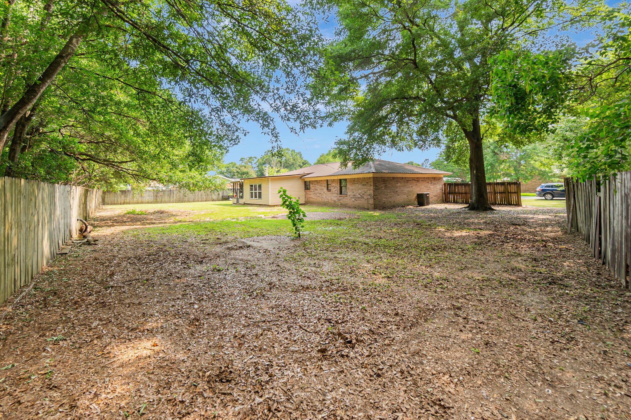 6517 Kennington Circle Milton, FL 32570 - Photo 35 of 37 a view of a house with a yard and tree s