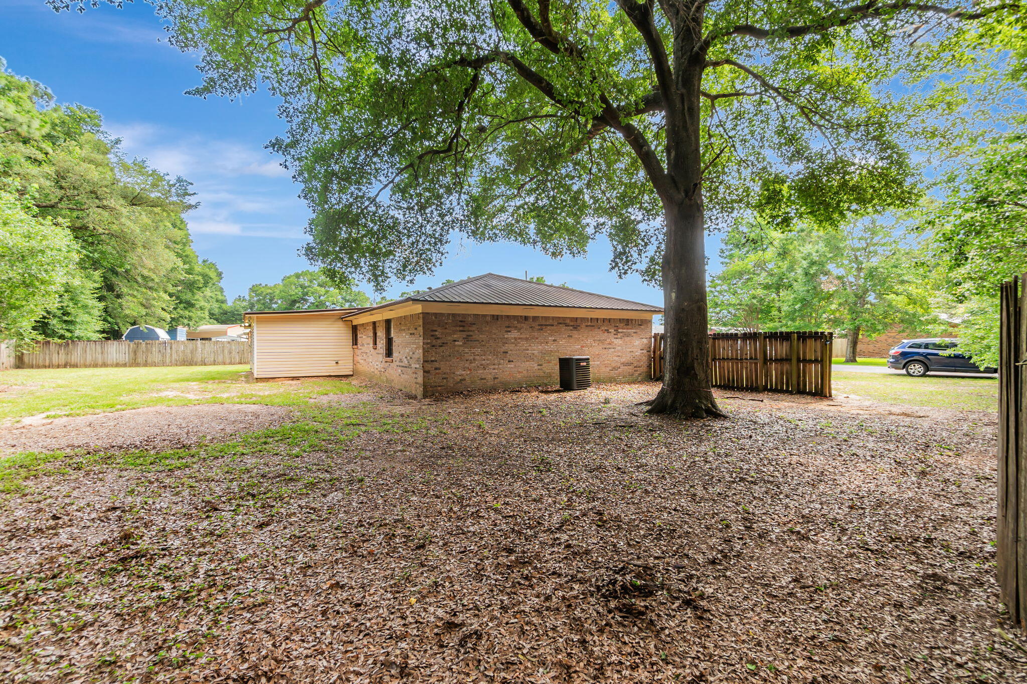 6517 Kennington Circle Milton, FL 32570 - Photo 36 of 37 a front view of a house with garden
