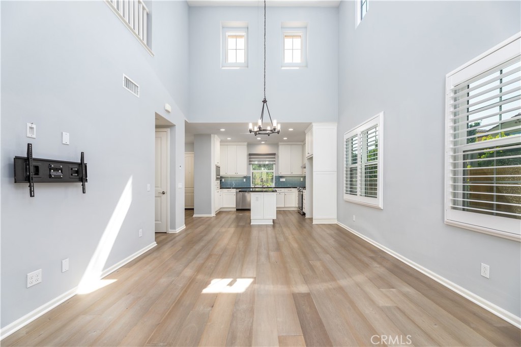 242 Firefly Irvine, CA 92618 - Photo 11 of 24 a view of a room with wooden floor and windows