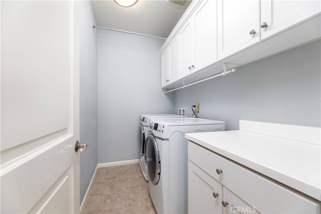 242 Firefly Irvine, CA 92618 - Photo 18 of 24 a utility room with dryer and washer