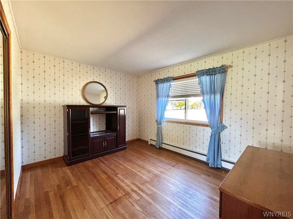 3564 Roszyk Hill Road Machias, NY 14101 - Photo 5 of 20 Rich hardwood floors anchor this inviting room ill