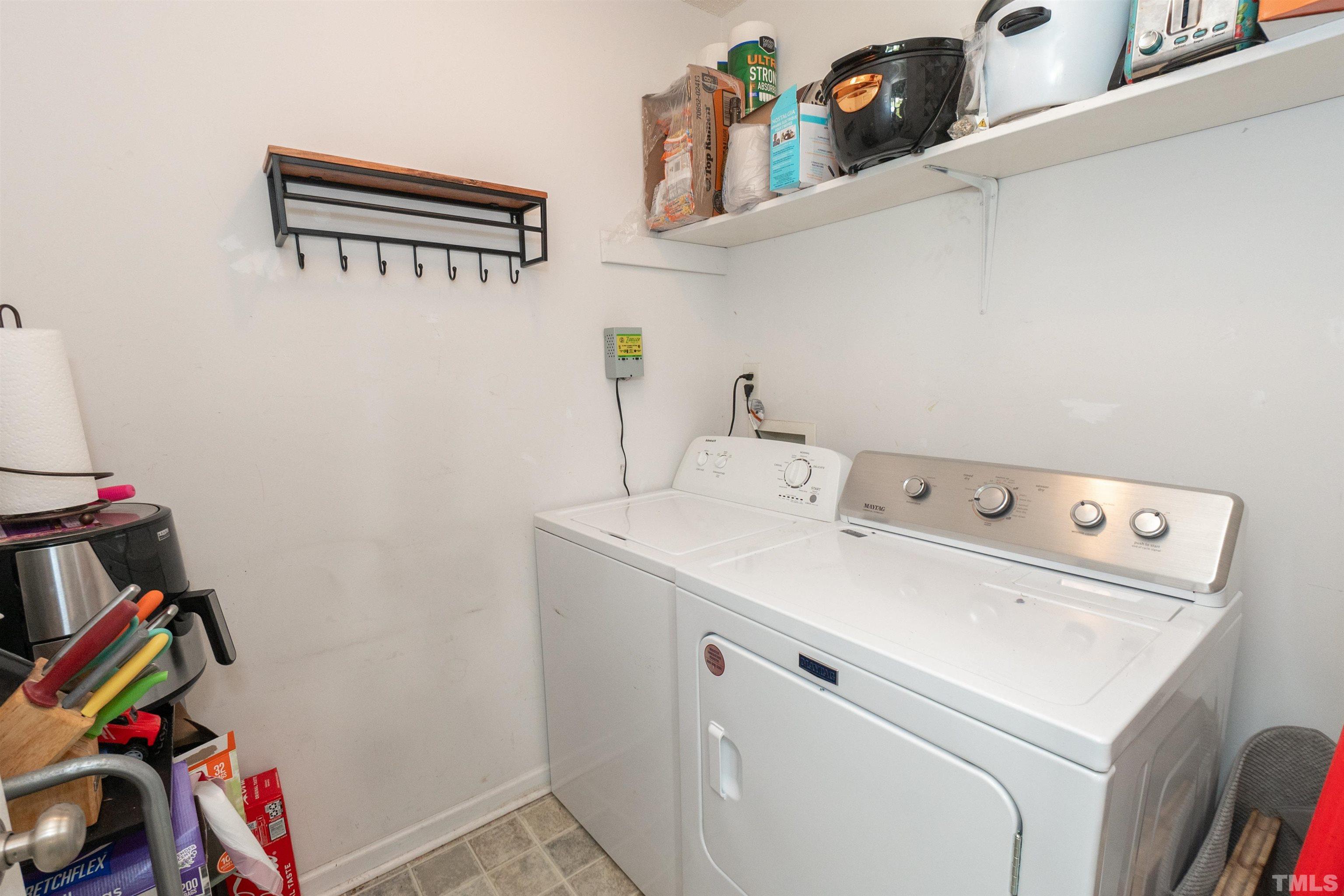 128 Edmondson Drive Willow Spring, NC 27592 - Photo 13 of 24 a utility room with dryer and washer