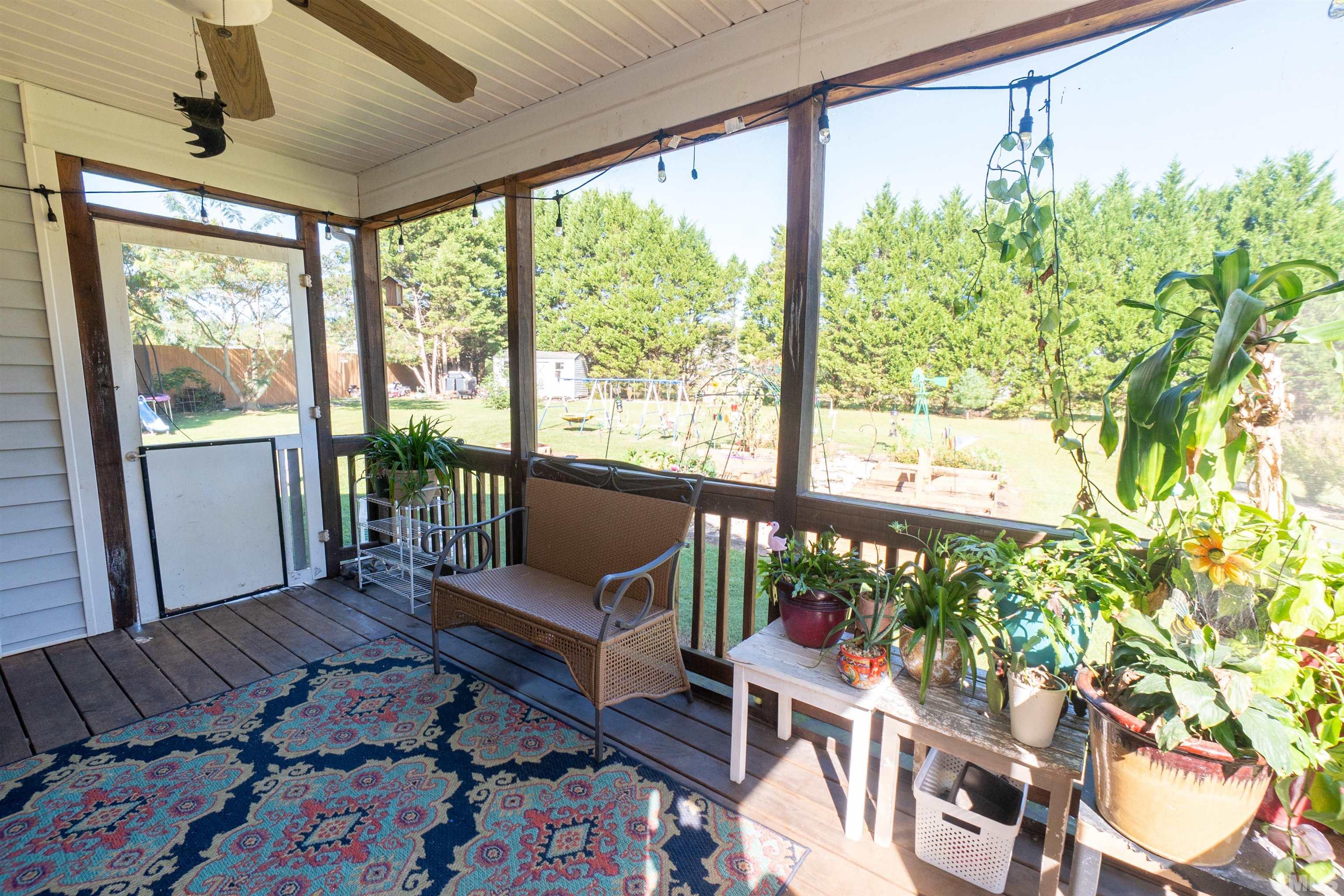 128 Edmondson Drive Willow Spring, NC 27592 - Photo 14 of 24 a living room with furniture and a large window