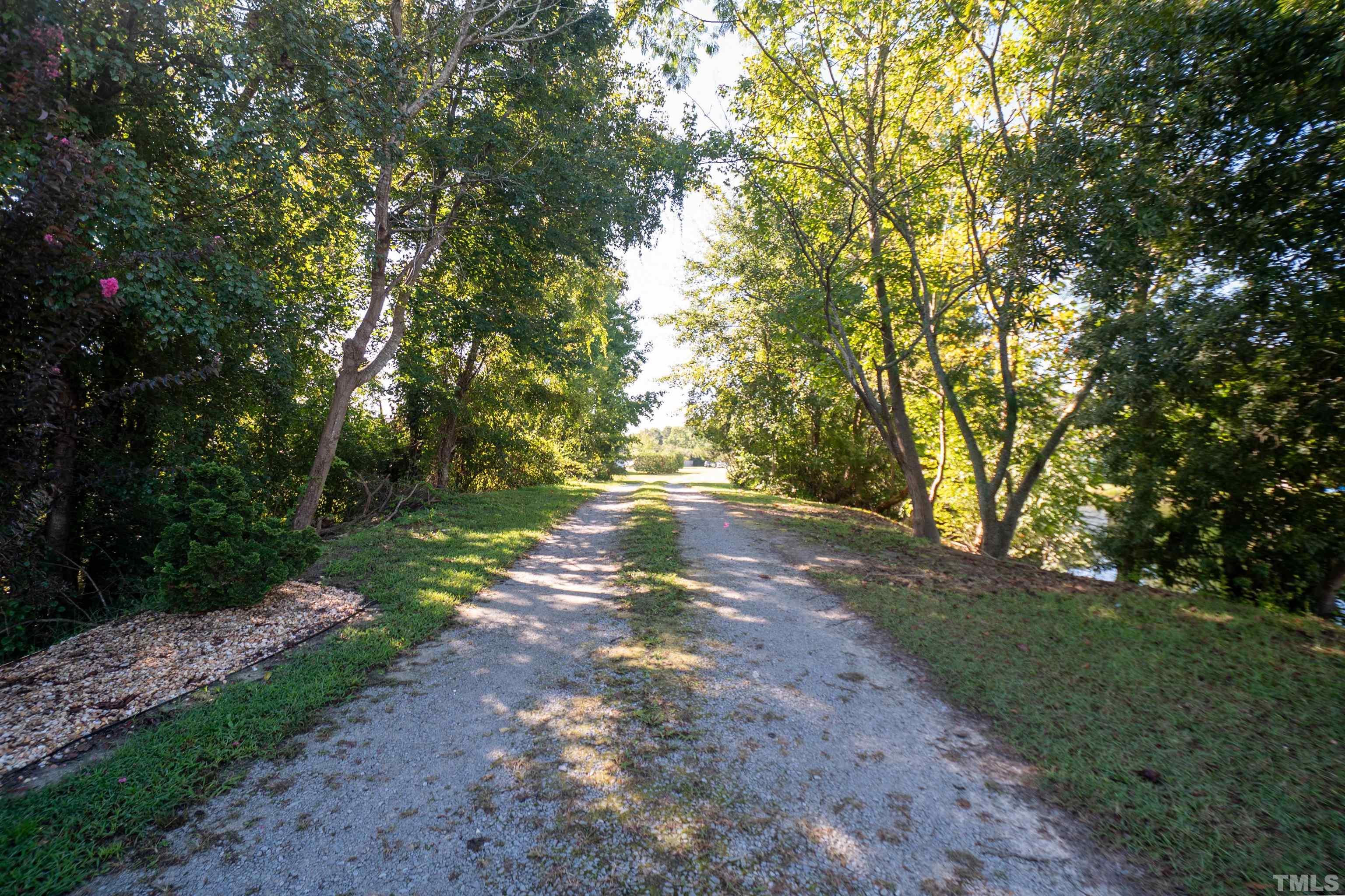 128 Edmondson Drive Willow Spring, NC 27592 - Photo 5 of 24 a view of an outdoor space with a lake view