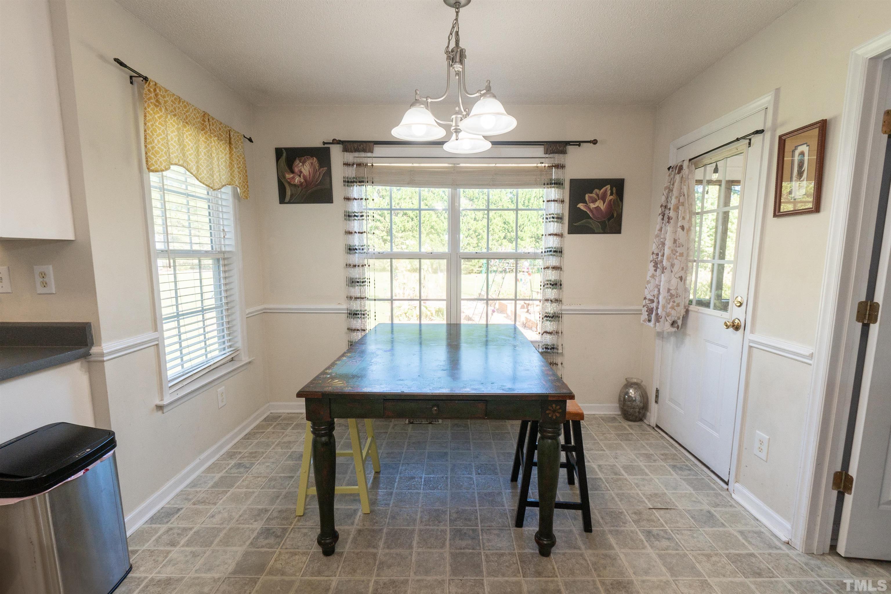 128 Edmondson Drive Willow Spring, NC 27592 - Photo 10 of 24 a dining room with furniture and window