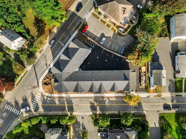 an aerial view of a house with a garden