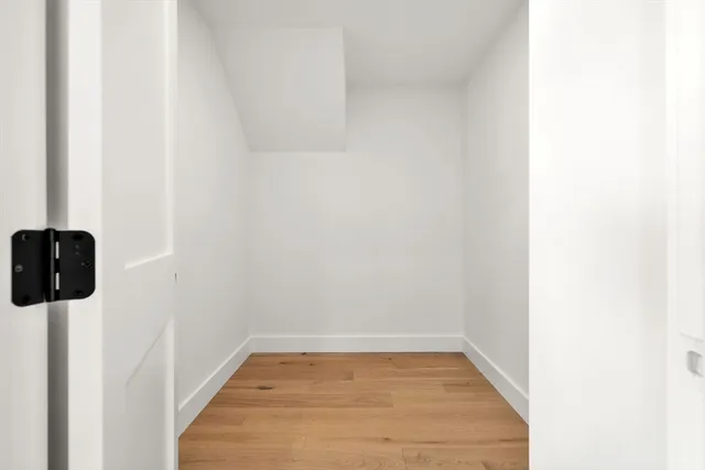 a view of a storage & utility room with a window