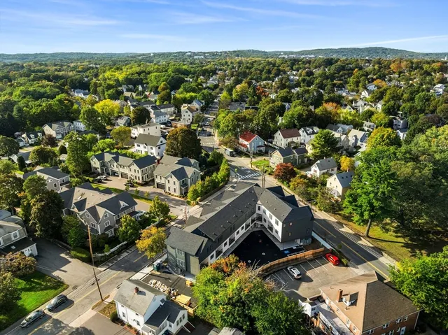an aerial view of residential houses with outdoor space