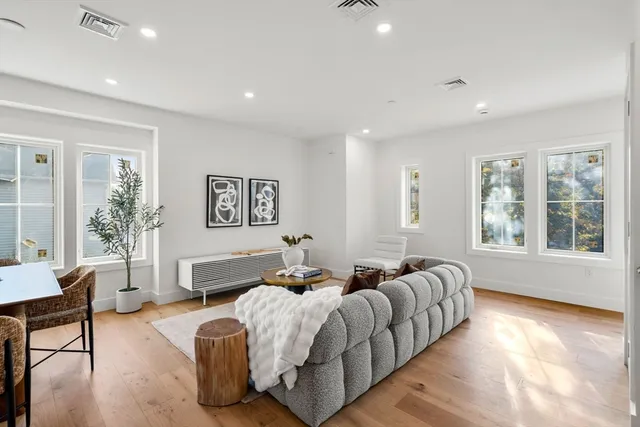 a spacious bedroom with a large bed and a couch