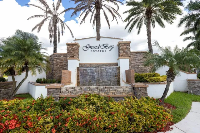 a view of front door and potted plants