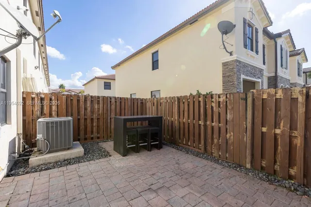 a view of a chairs with wooden fence