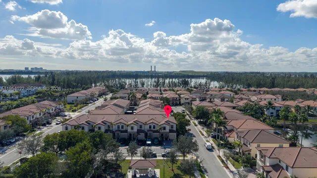 an aerial view of lake and city