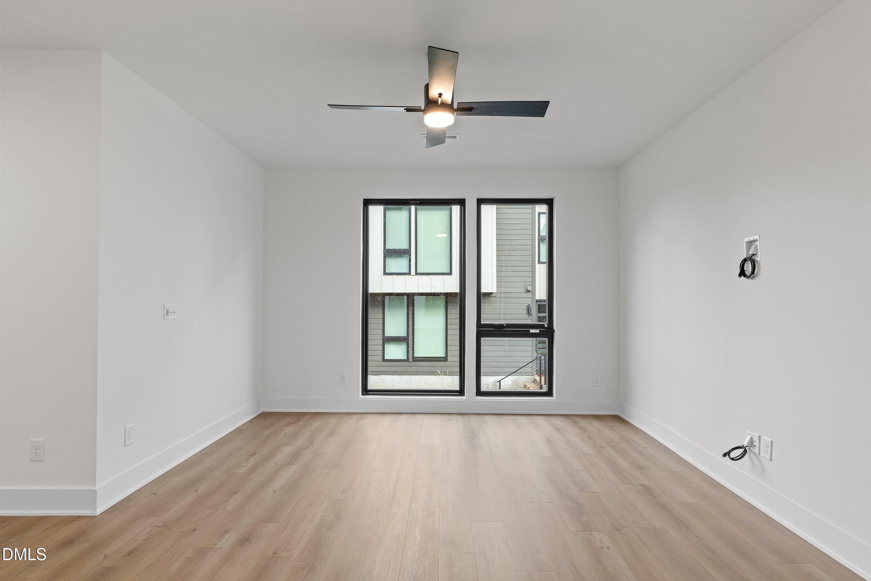 512 Gordon Street, Unit 901 Durham, NC 27701 - Photo 11 of 30 wooden floor in an empty room with a window