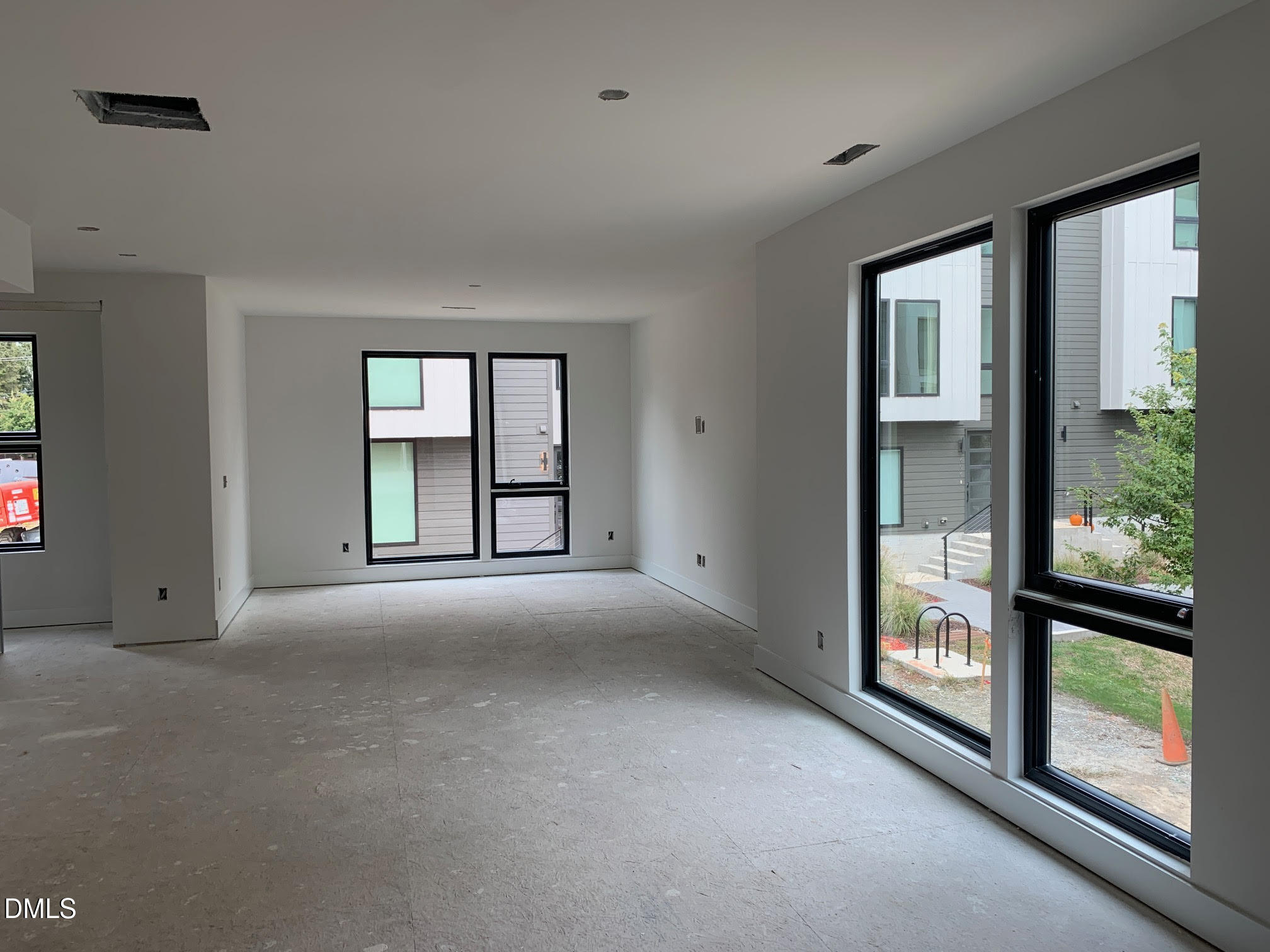 512 Gordon Street, Unit 901 Durham, NC 27701 - Photo 18 of 32 wooden floor and windows in an empty room