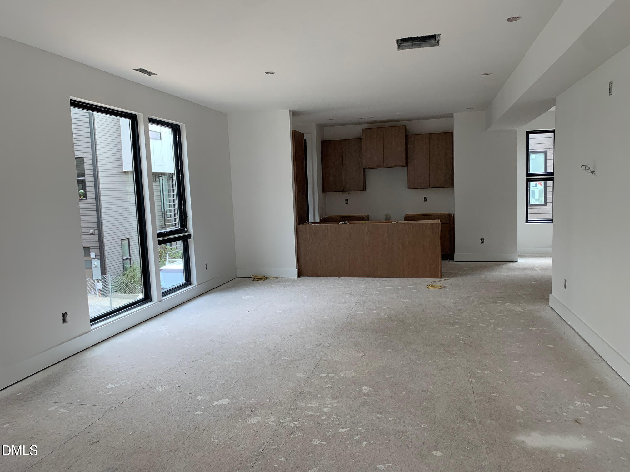 512 Gordon Street, Unit 901 Durham, NC 27701 - Photo 19 of 32 a view of a big room with windows and chandelier