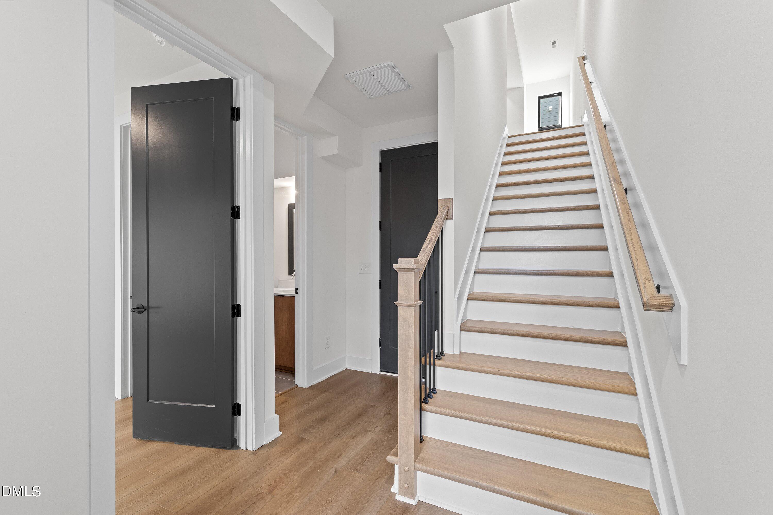 512 Gordon Street, Unit 901 Durham, NC 27701 - Photo 4 of 30 a view of a hallway with wooden floor and entryway
