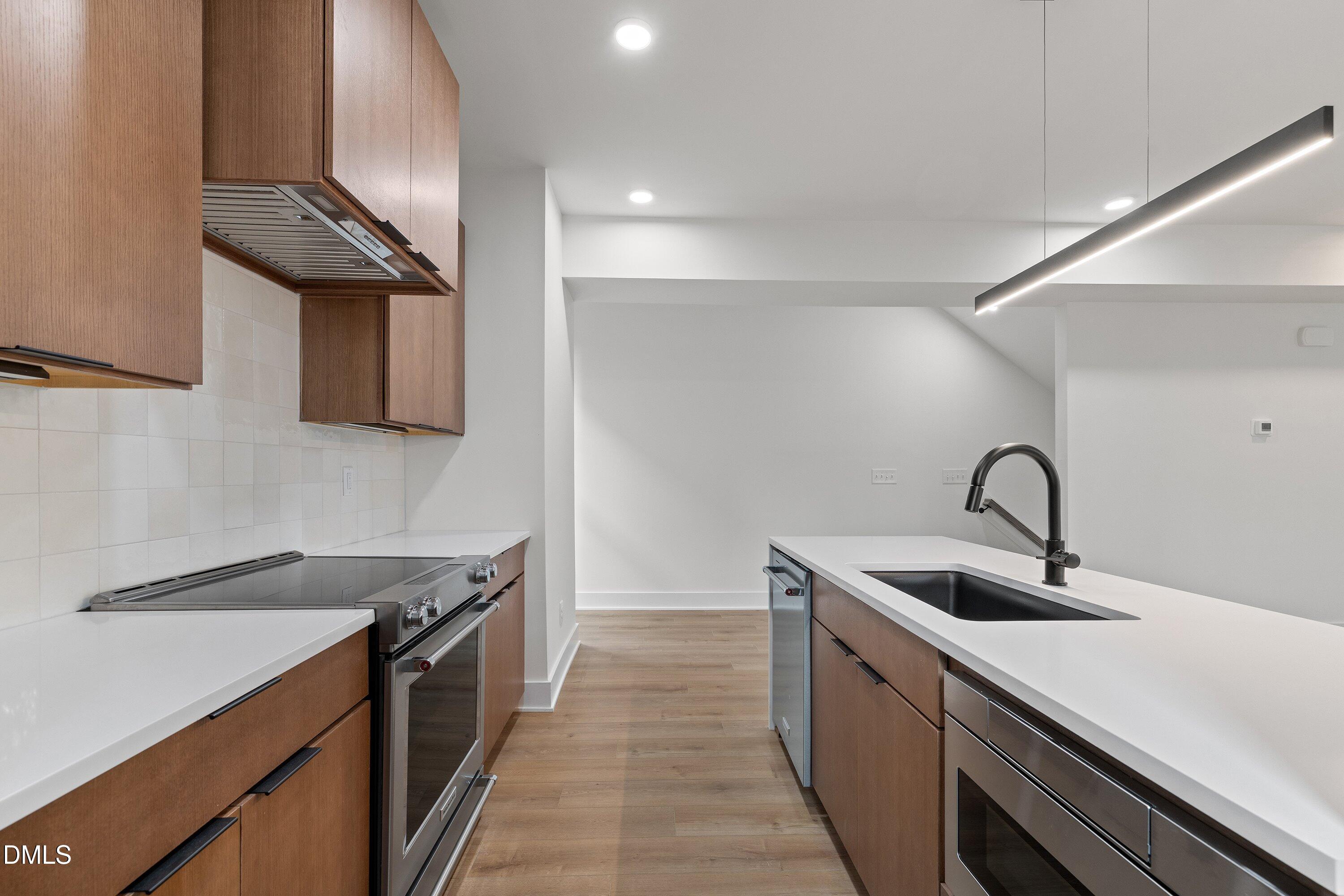 512 Gordon Street, Unit 901 Durham, NC 27701 - Photo 8 of 30 a kitchen that has a sink and a stove