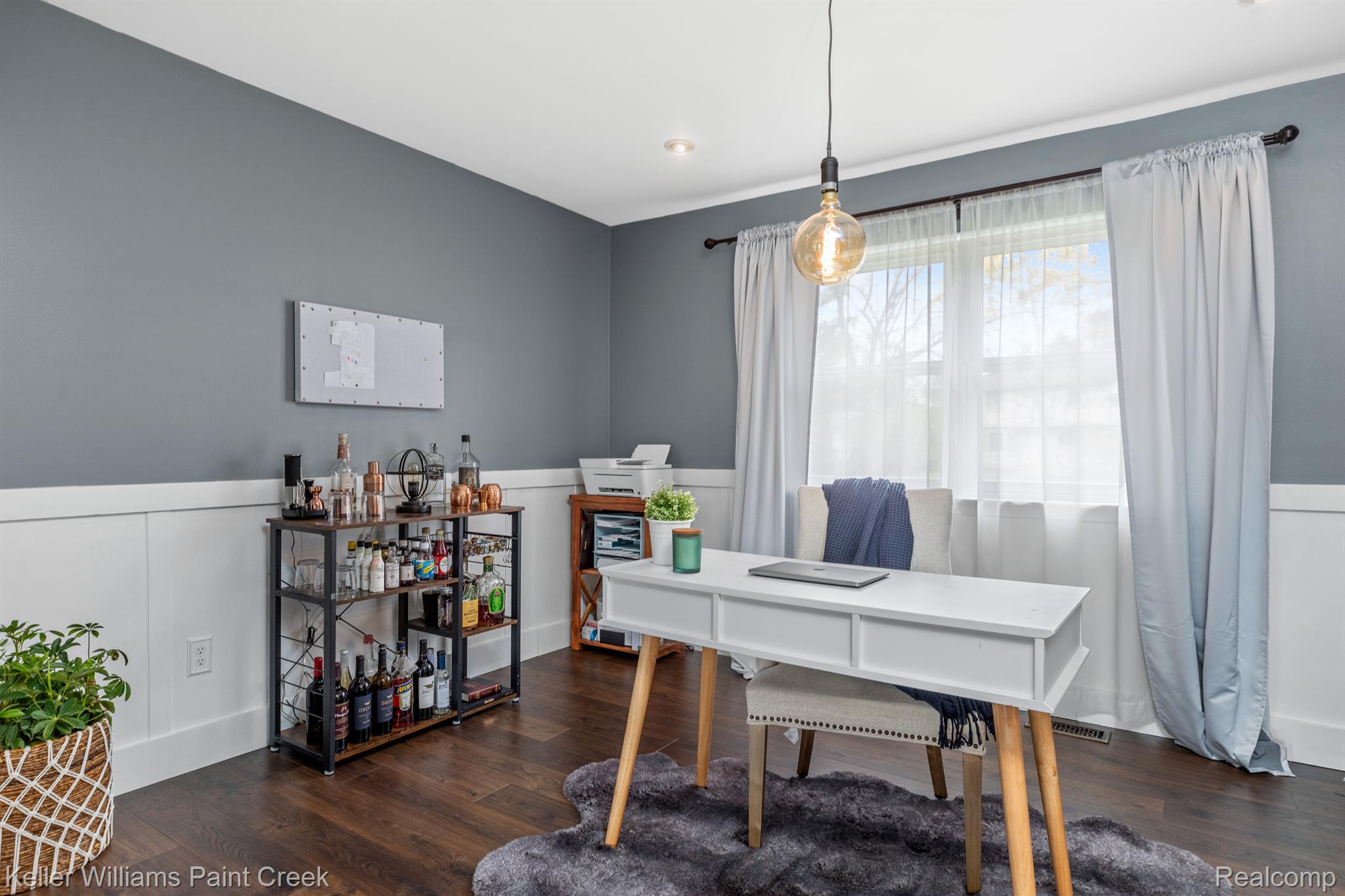 Updated dining room flexes as a home office.